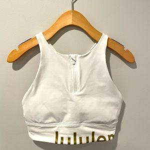 Lululemon Special Edition High Neck Zip up Bra. White w/ gold. Sz 6. Barely worn